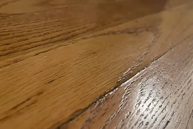 Hardwood boards cupped and swollen by water